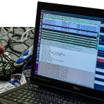 A person works at a computer during the 10th International Cybersecurity Forum in Lille