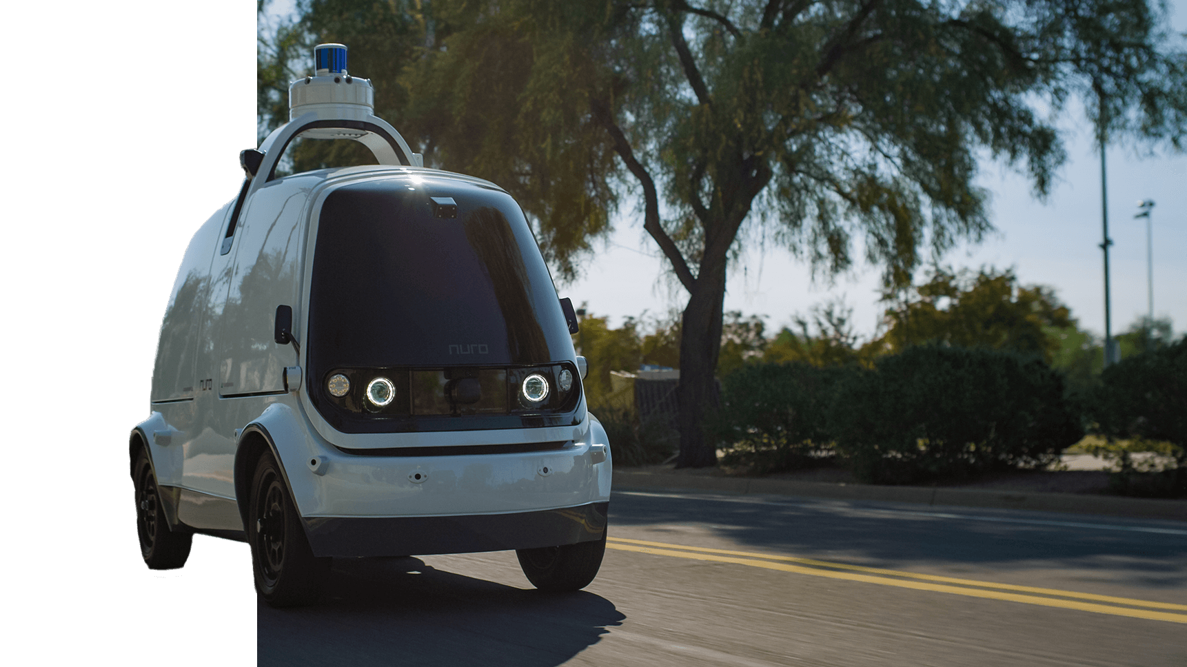 A Nuro autonomous car is seen driving down a road in Scottsdale, Arizona