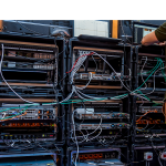 A man works next to servers specialised in cyber security during the 10th International Cybersecurity Forum in Lille