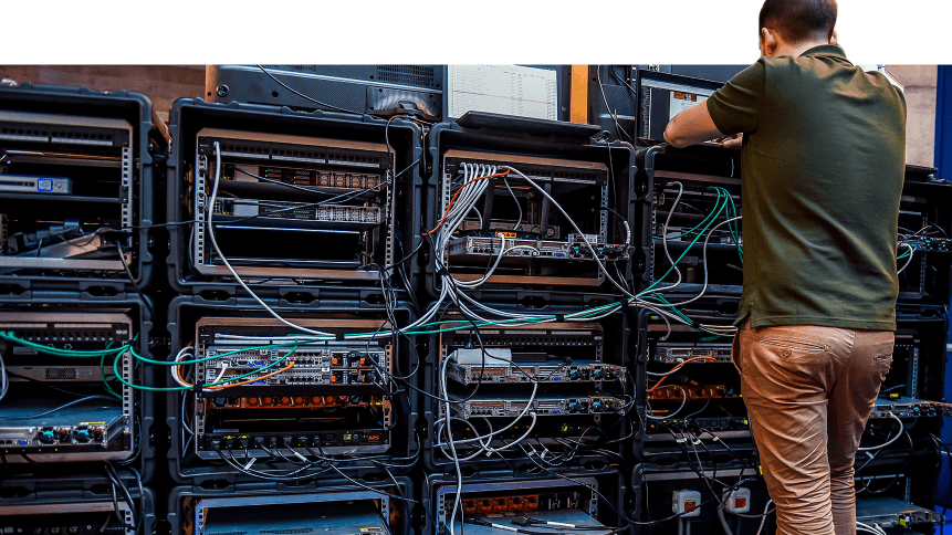 A man works next to servers specialised in cyber security during the 10th International Cybersecurity Forum in Lille