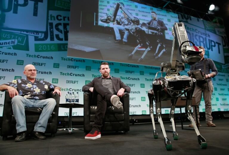Marc Raibert, Founder of Boston Dynamics, TechCrunch Moderator Darrell Etherington and Boston Dynamics' Spot robot attend a Q&A during day 1 of TechCrunch Disrupt London at the Copper Box on December 5, 2016 in London, England.