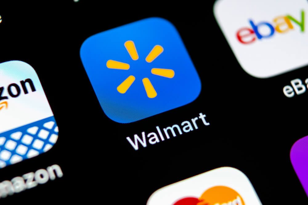 Walmart application icon on Apple iPhone X screen close-up. Walmart app icon. Walmart.com is multinational retailing corporation.