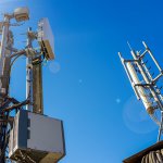5G smart mobile telephone radio network antenna base station on the telecommunication mast radiating signal