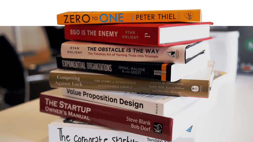 Stack of books related to startups