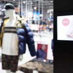 Intelligent Digital Signage , Augmented reality marketing and face recognition concept. Interactive artificial intelligence digital advertisement in fashion retail shopping Mall
