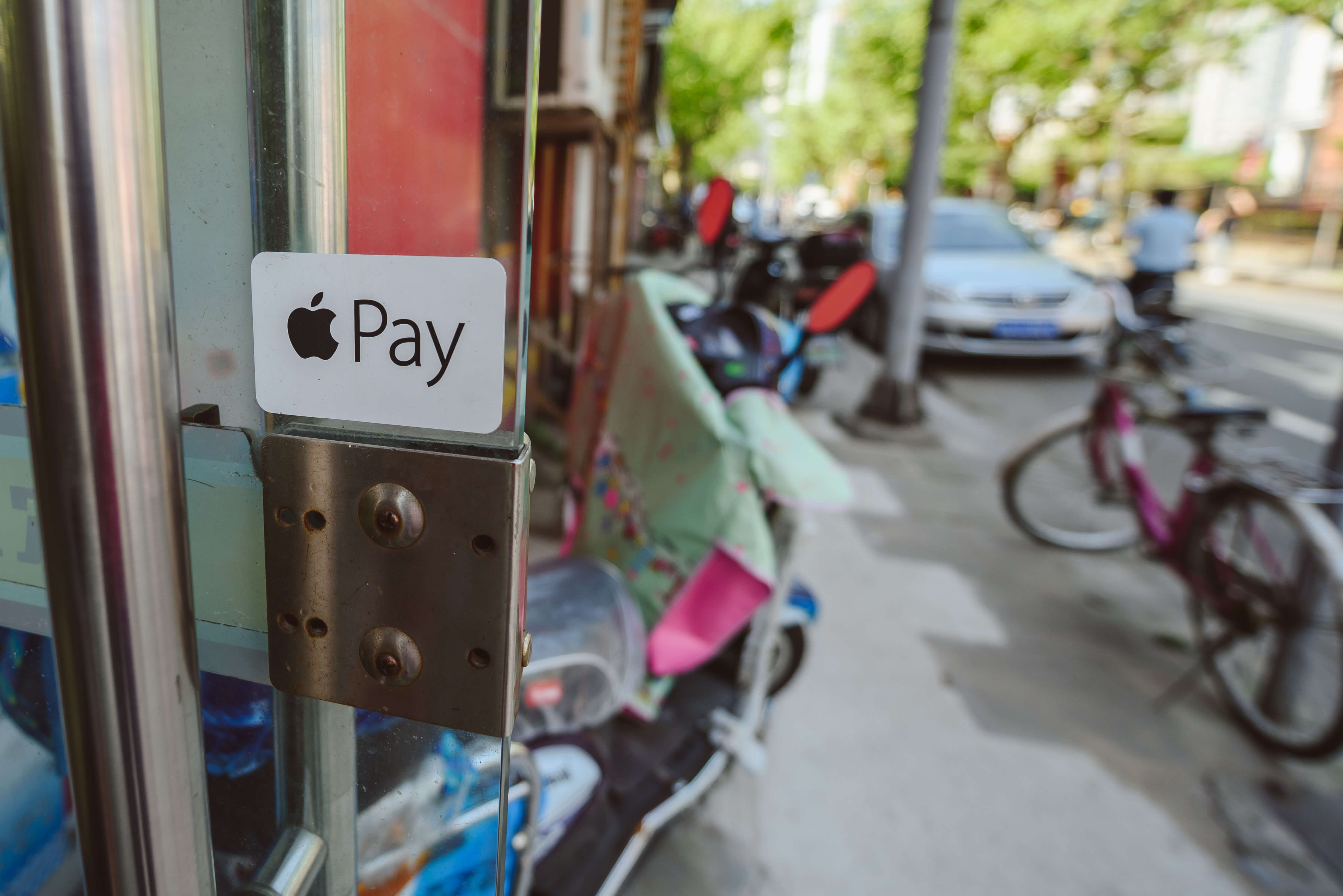 Apple Pay logo on small shop in Shanghai