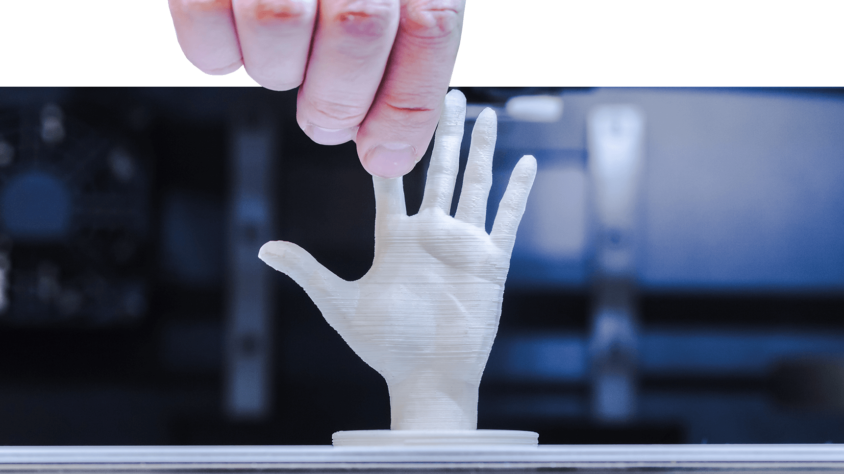 3D printer creates a human hand.
