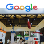 People gather at the booth of Google during the China Digital Entertainment Expo and Conference