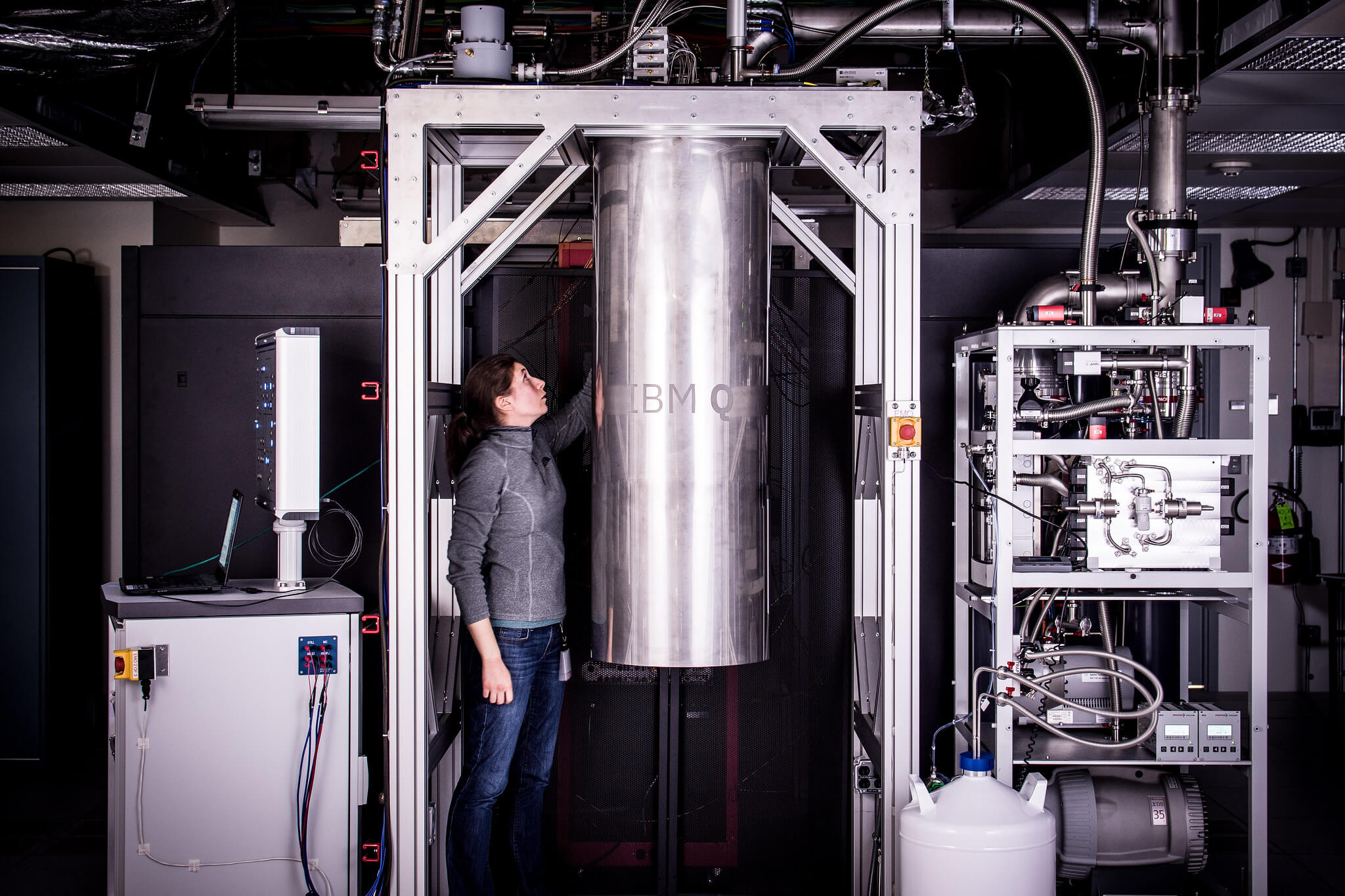 IBM Research Staff Member Katie Pooley examining a new prototype commercial quantum processor.