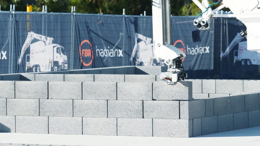 A HadrianX bricklaying robot in action.