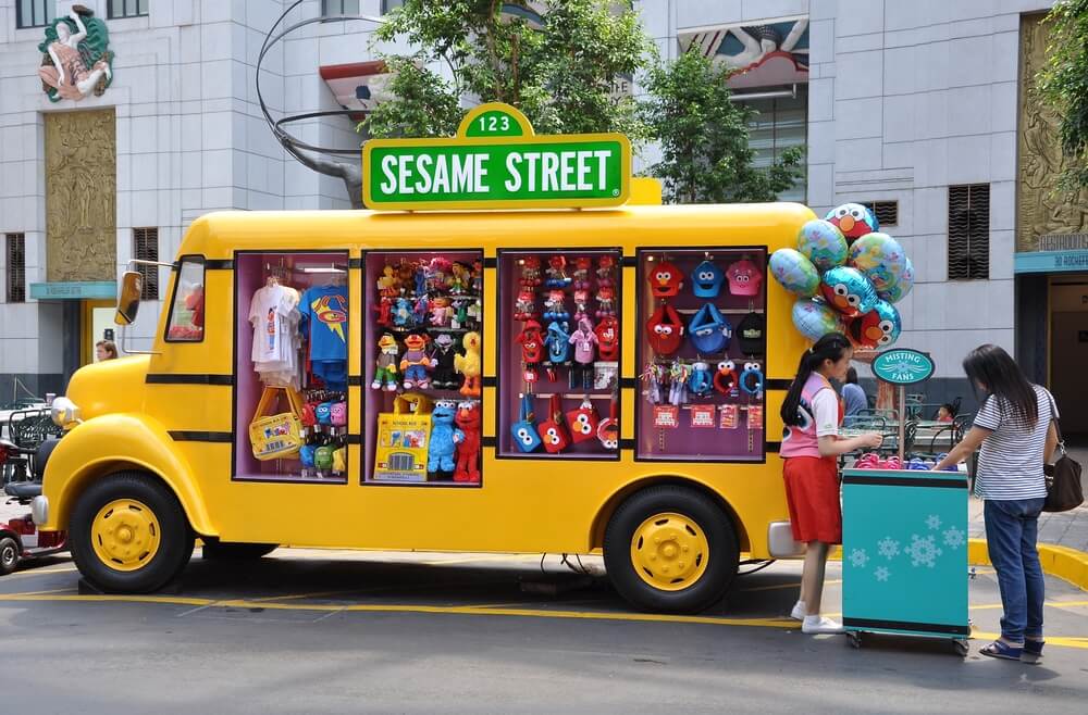Yellow truck that sells Sesame Street merchandise at Universal Studios Singapore