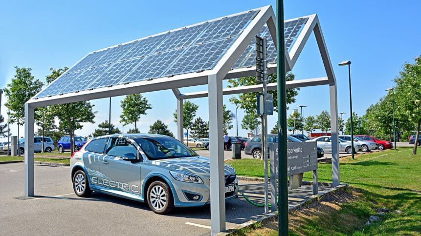 An electric car charges from a solar energy charger in Sweden.