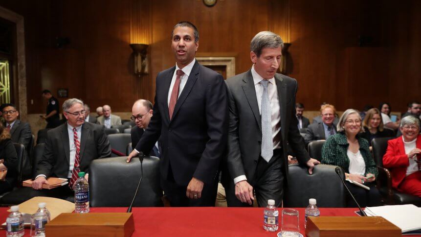 FCC Chairman Ajit Pai (L) and FTC Chairman Joseph Simons prepare to testify before the Senate Financial Services and General Government Subcommittee about their FY2020 budget. Senators asked about their plans for the future of 5G