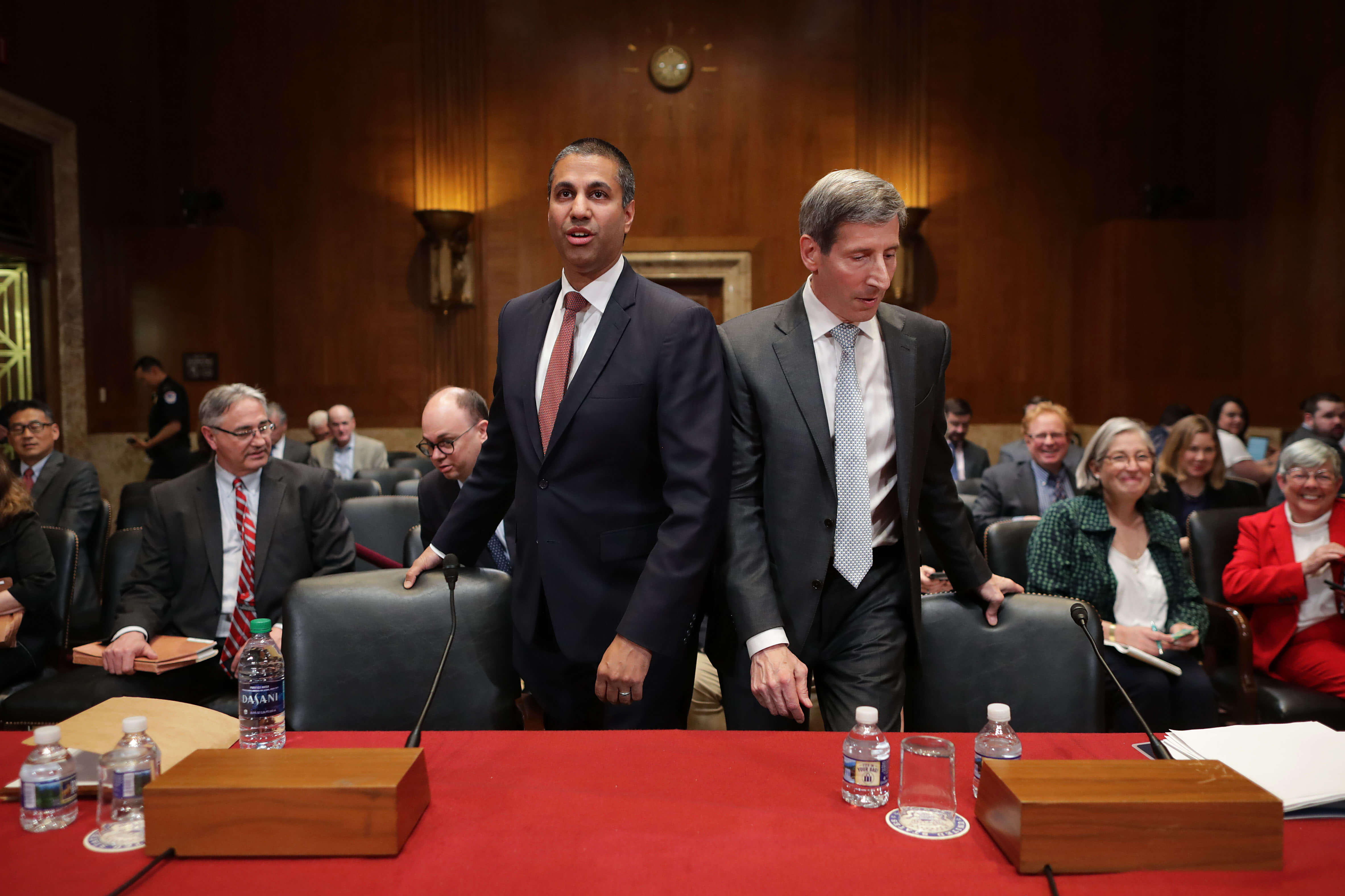 FCC Chairman Ajit Pai (L) and FTC Chairman Joseph Simons prepare to testify before the Senate Financial Services and General Government Subcommittee about their FY2020 budget. Senators asked about their plans for the future of 5G
