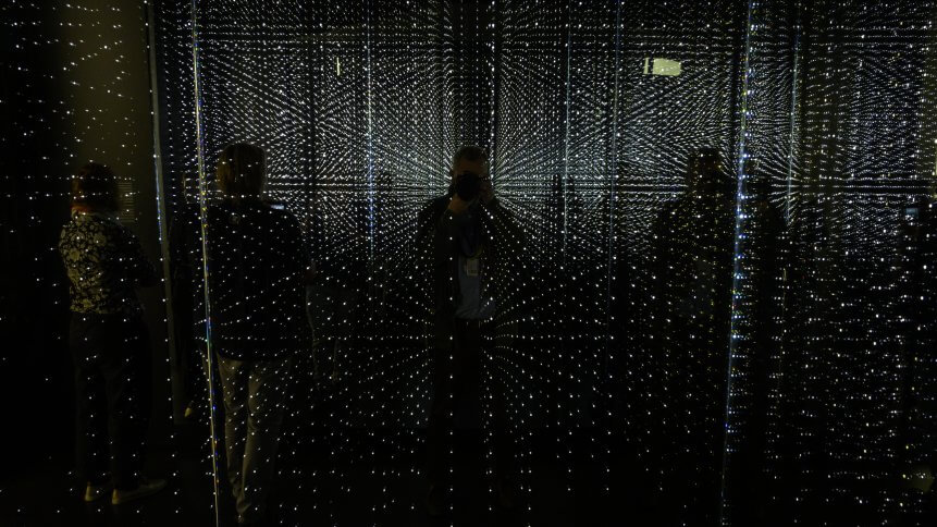 Visitors check out an infinity chamber seeking to reproduce the atmosphere of a large data centre at the "Futurium", House of Futures in Berlin