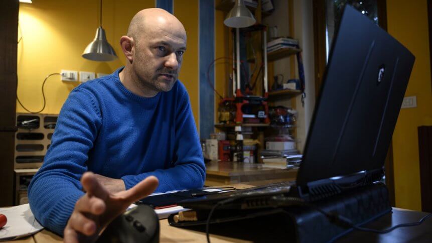 Italian engineer Mario Milanesio works on a 3D-printing project of respiratory valve fittings.