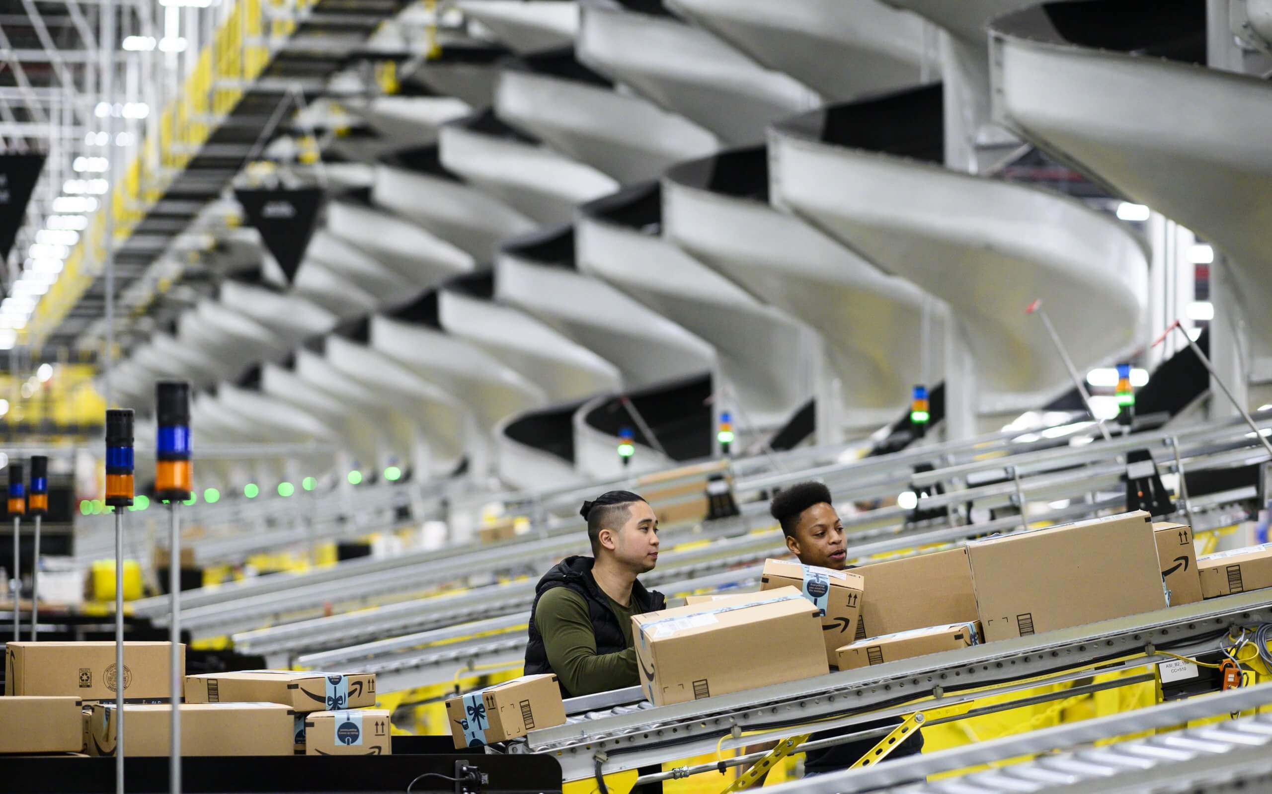 Workers at a distribution station in the 855,000-square-foot Amazon fulfillment center in Staten Island, NY