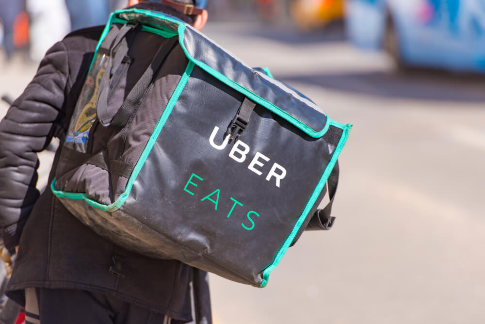 Uber is expanding beyond its core business model. Source: Shutterstock