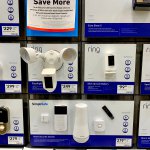 Ring and Google Nest security cameras on display inside a Lowe's home improvement store