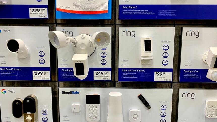 Ring and Google Nest security cameras on display inside a Lowe's home improvement store