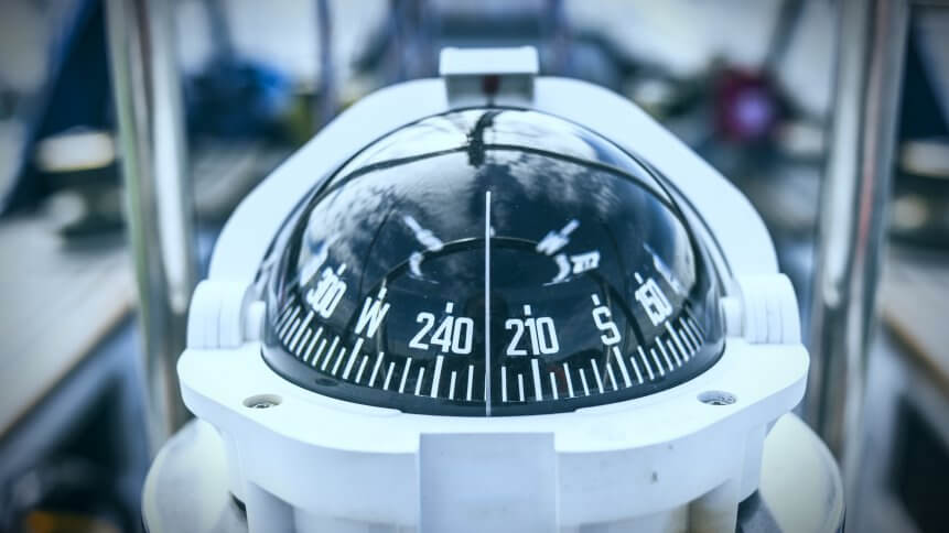A compass, a front view from on a sailing yacht.