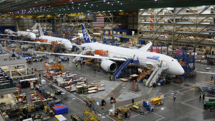 Unidentified Boeing employees continue work building a Boeing 787 jets at its Everett factory, including for Japanese airline All Nippon Airways