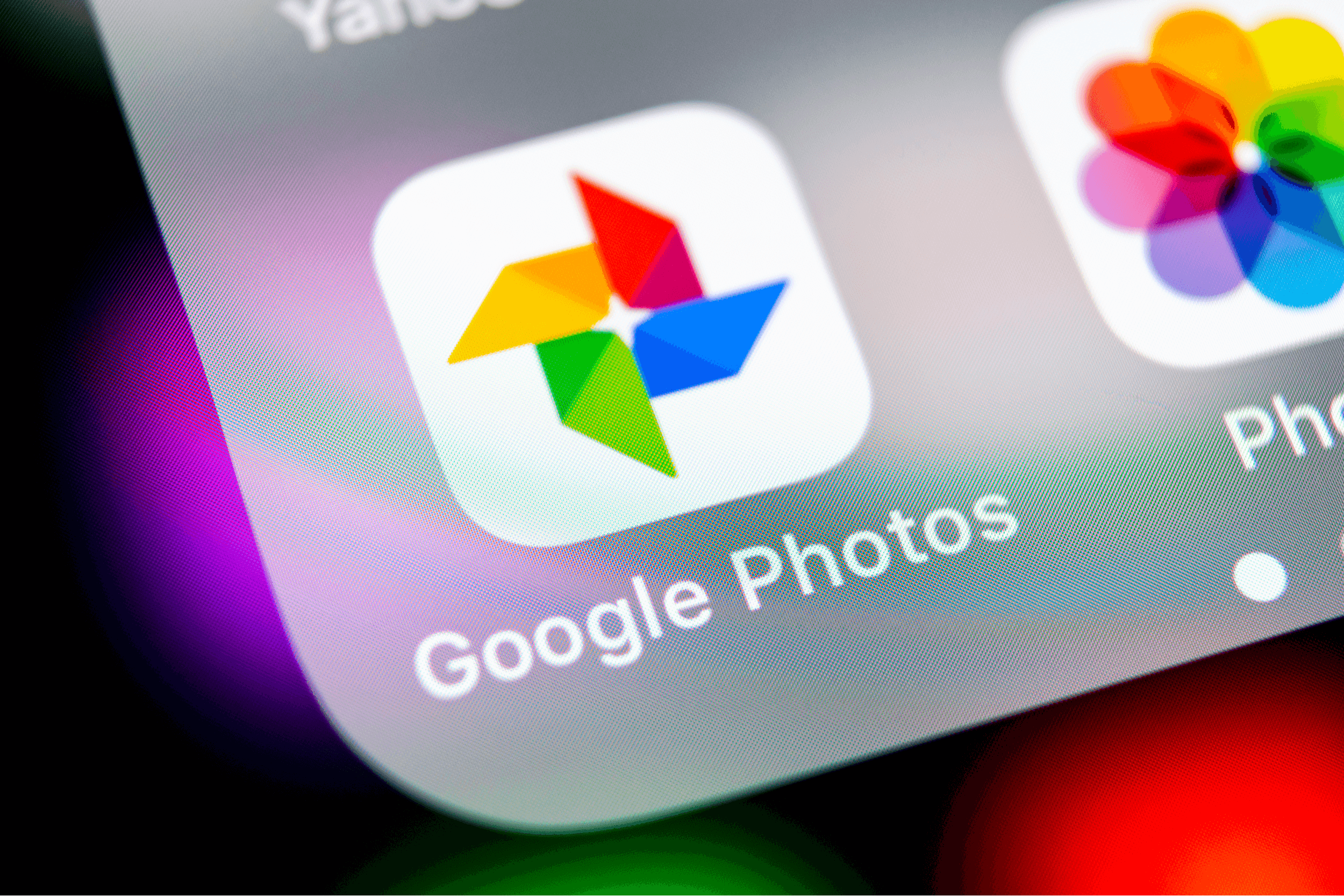 Google Photos plus application icon on Apple iPhone X screen close-up. Google plus Photos icon. Google photos application. Social media network