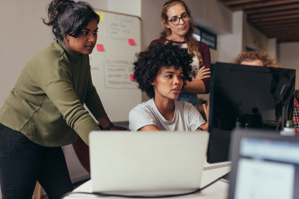 Women in tech solving problems.