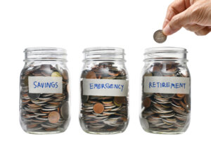 Jars of emergency savings. SecureSave is a simple piece of tech that helps you save your money for the inevitable rainy day.