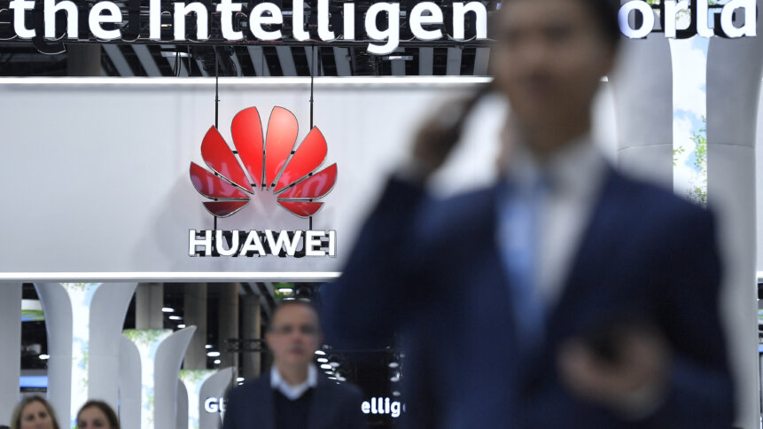 The AI chip business of Huawei is progressing, with Baidu reportedly purchasing a bulk of them recently. (Photo by Pau BARRENA / AFP)