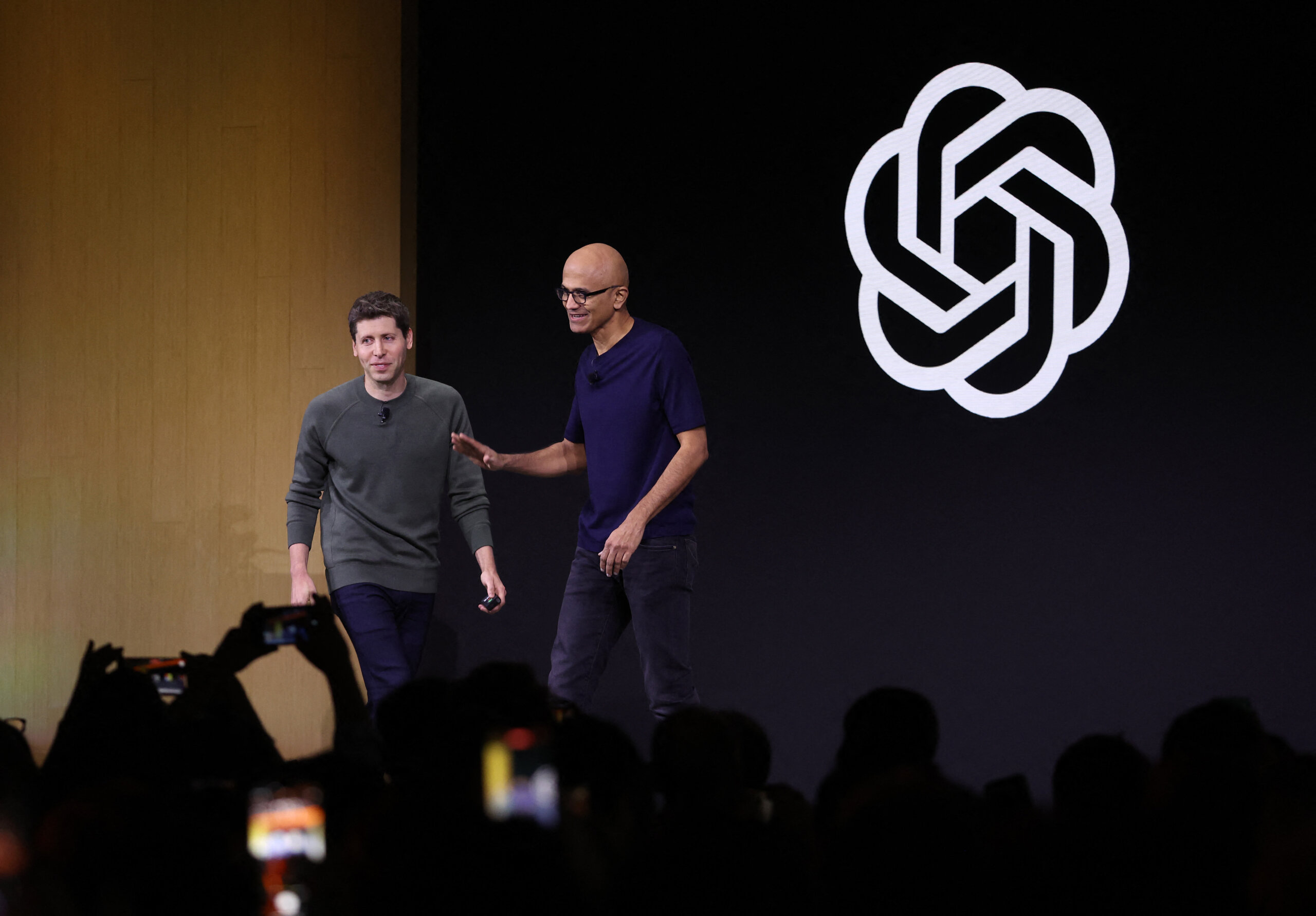 Microsoft CEO Satya Nadella (R) greets OpenAI CEO Sam Altman during the OpenAI DevDay event on November 06, 2023 in San Francisco, California. Altman delivered the keynote address at the first-ever Open AI DevDay conference. Justin Sullivan/Getty Images/AFP (Photo by JUSTIN SULLIVAN / GETTY IMAGES NORTH AMERICA / Getty Images via AFP).