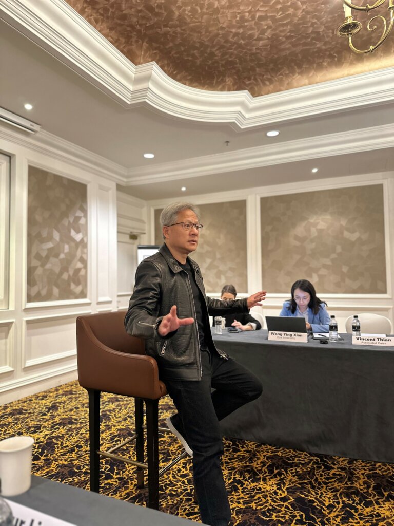 Clad in his signature look – a black leather jacket, often paired with a black T-shirt and black jeans, which he wears every time he is in the public eye – Huang spent an hour with local reporters during his maiden trip to Malaysia. Photo: Tech Wire Asia/TechHQ