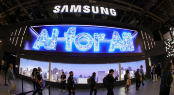 Attendees enter the Samsung booth as a digital message "AI for All" is displayed during CES 2024 at the Las Vegas Convention Center. (Photo by Ethan Miller/GETTY IMAGES NORTH AMERICA/Getty Images via AFP).